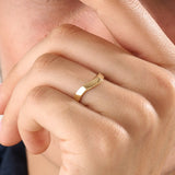 Model wearing a 14k gold vermeil curve band ring with a softly curved design, showcasing a timeless minimalist style for women.

