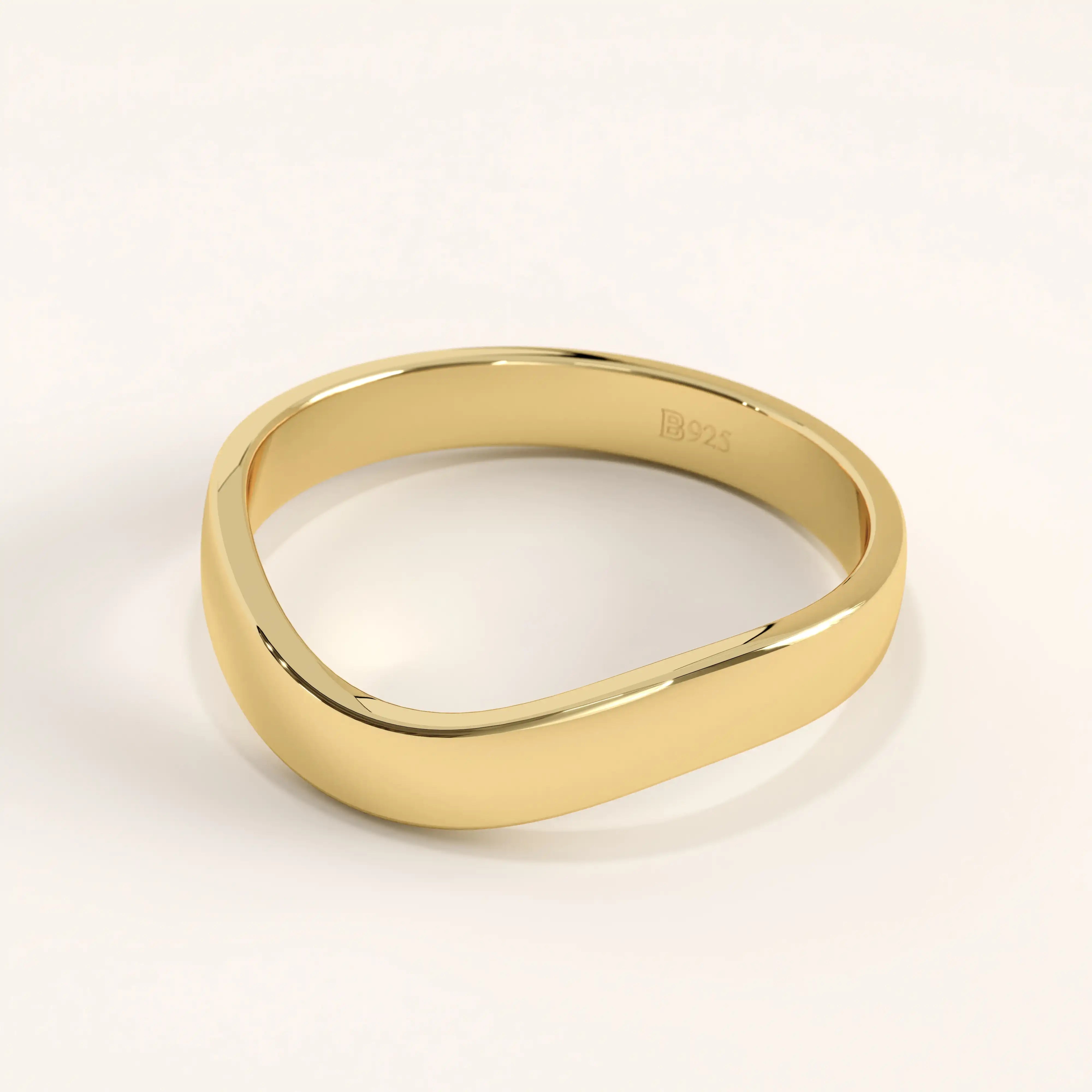 Side angle of 14k gold vermeil curve band ring showing the smooth contoured shape and reflective surface.
