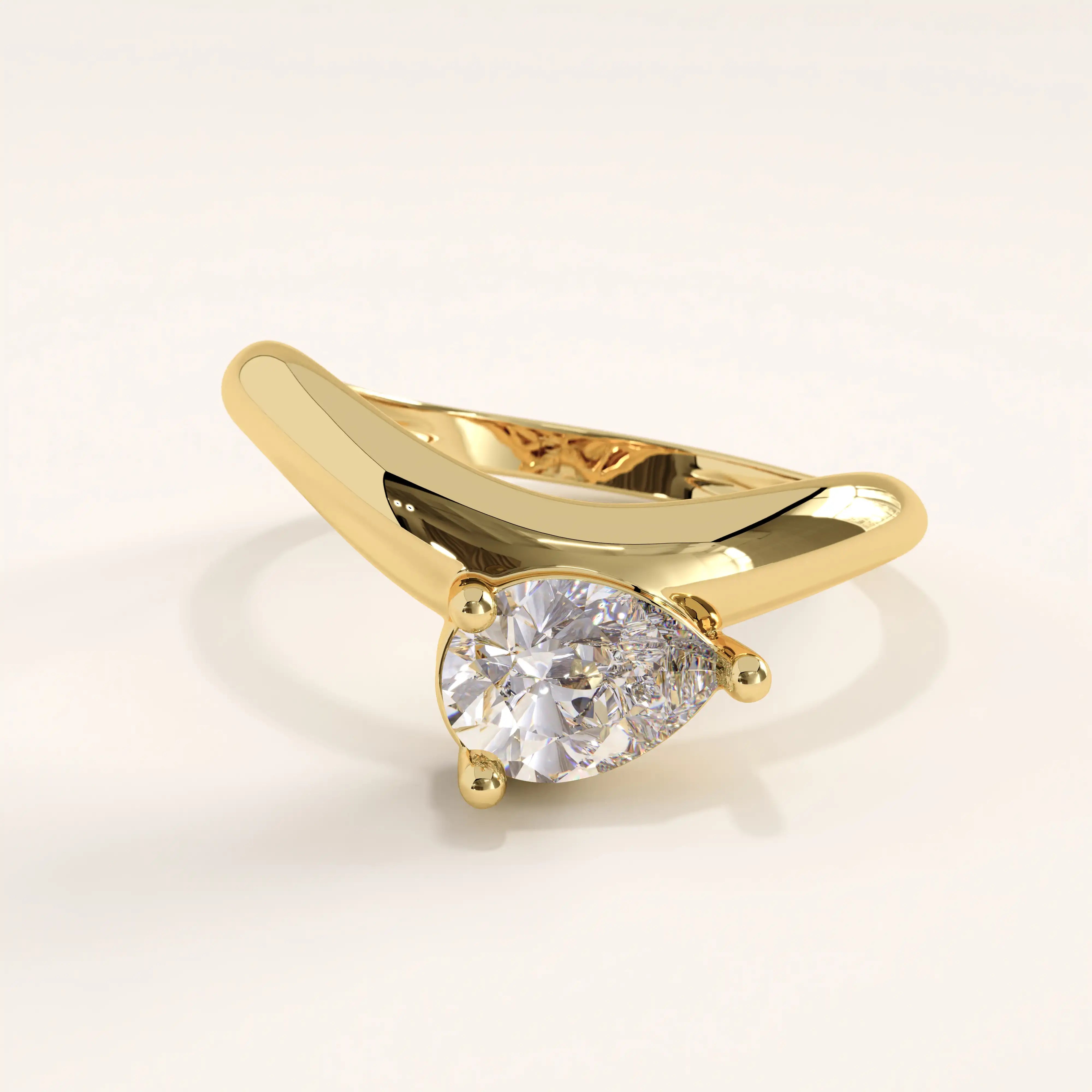 14k gold vermeil curve pear ring featuring a pear-cut cubic zirconia stone set in a sculptural curved band, blending elegance with modern artistry.
