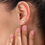 Model wearing 14k gold vermeil curvy marquise earrings highlighting the sculpted form and shimmering marquise stone that add refined allure to any outfit.
