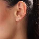 Model wearing 14k gold vermeil curvy marquise earrings highlighting the sculpted form and shimmering marquise stone that add refined allure to any outfit.
