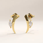 Side view of 14k gold vermeil curvy marquise earrings showcasing the gentle curve and luminous marquise-cut stone for an elevated, graceful look.

