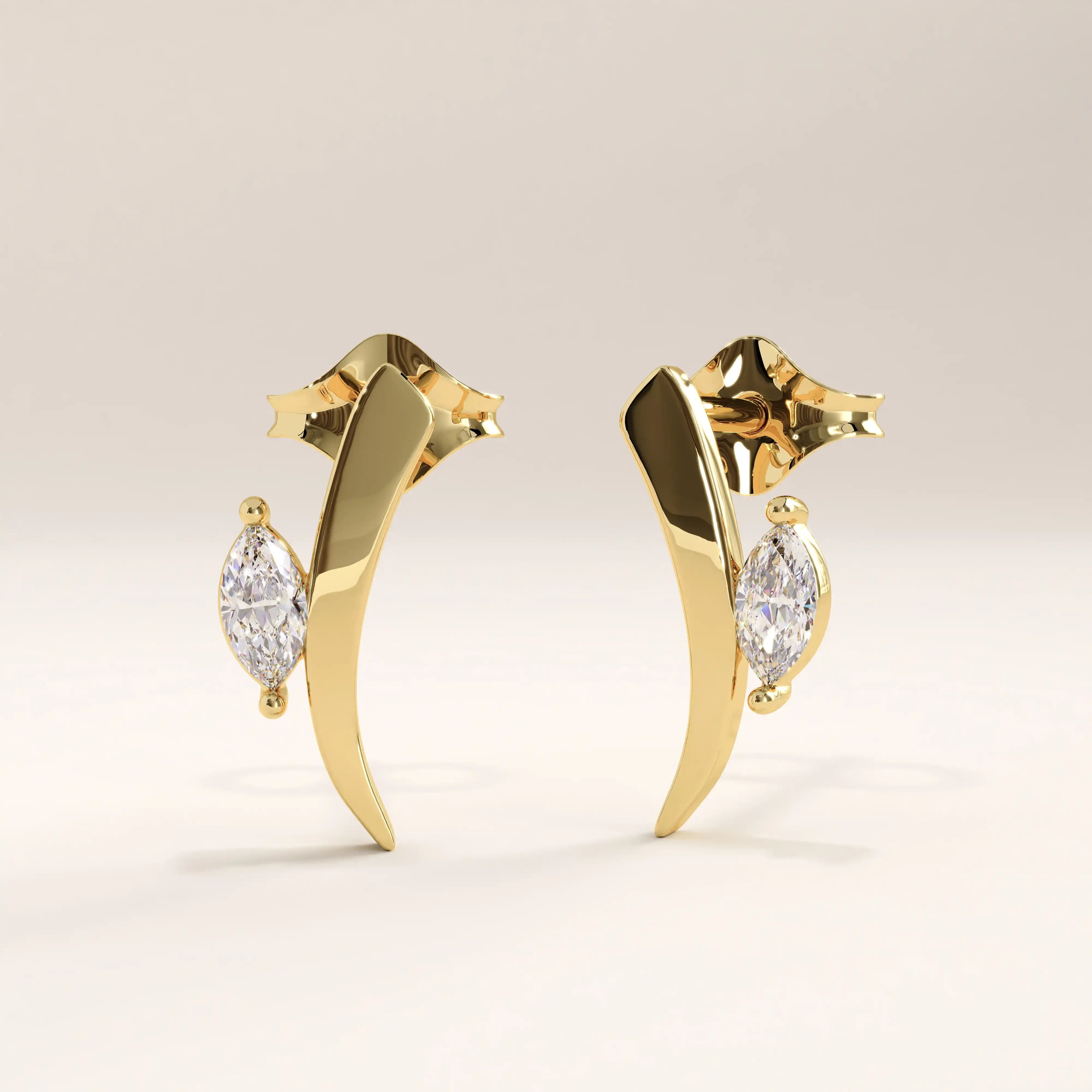 Side view of 14k gold vermeil curvy marquise earrings showcasing the gentle curve and luminous marquise-cut stone for an elevated, graceful look.
