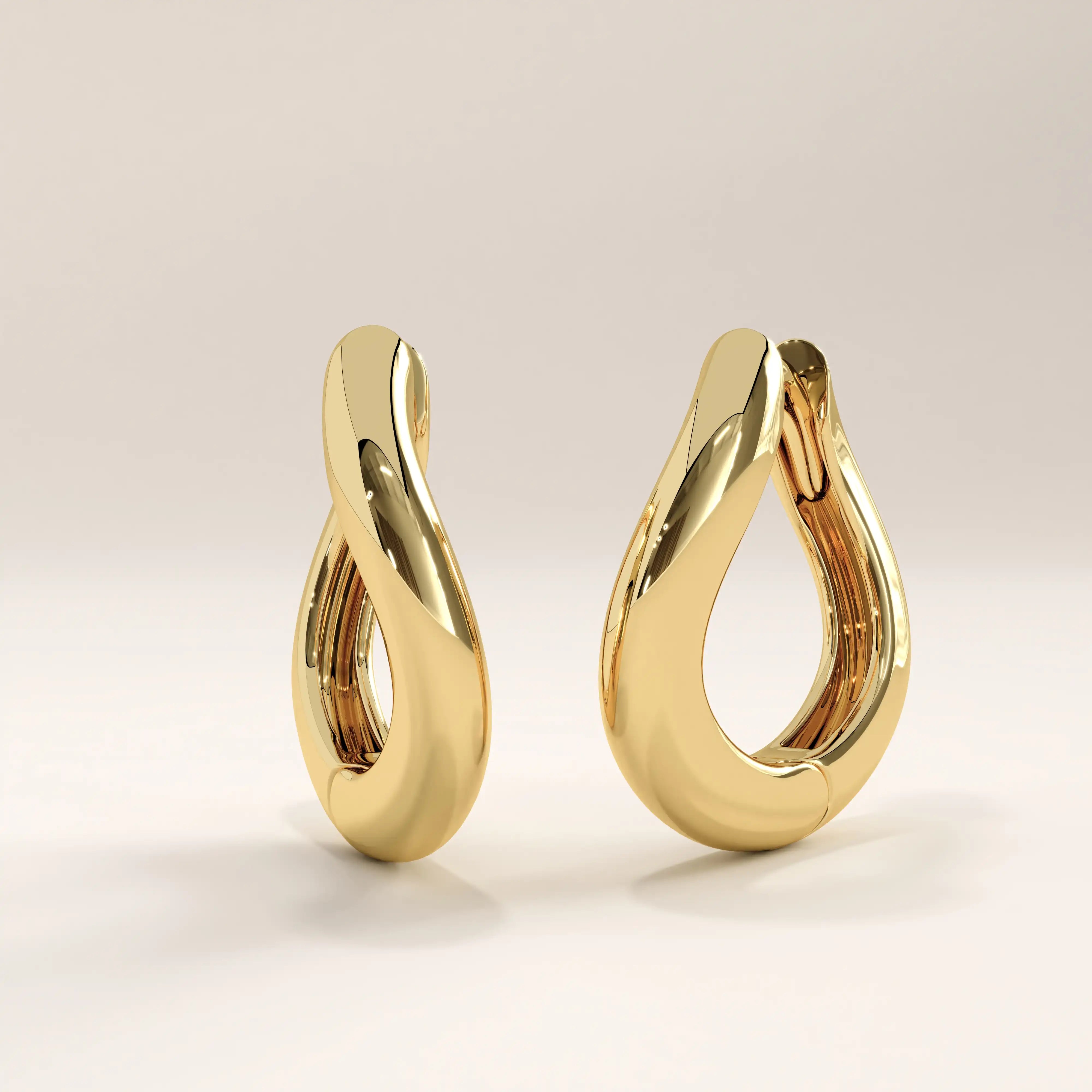 Side view of 14k gold vermeil dome hoop earrings highlighting the elegant curved structure and seamless hinge closure for everyday comfort and style.

