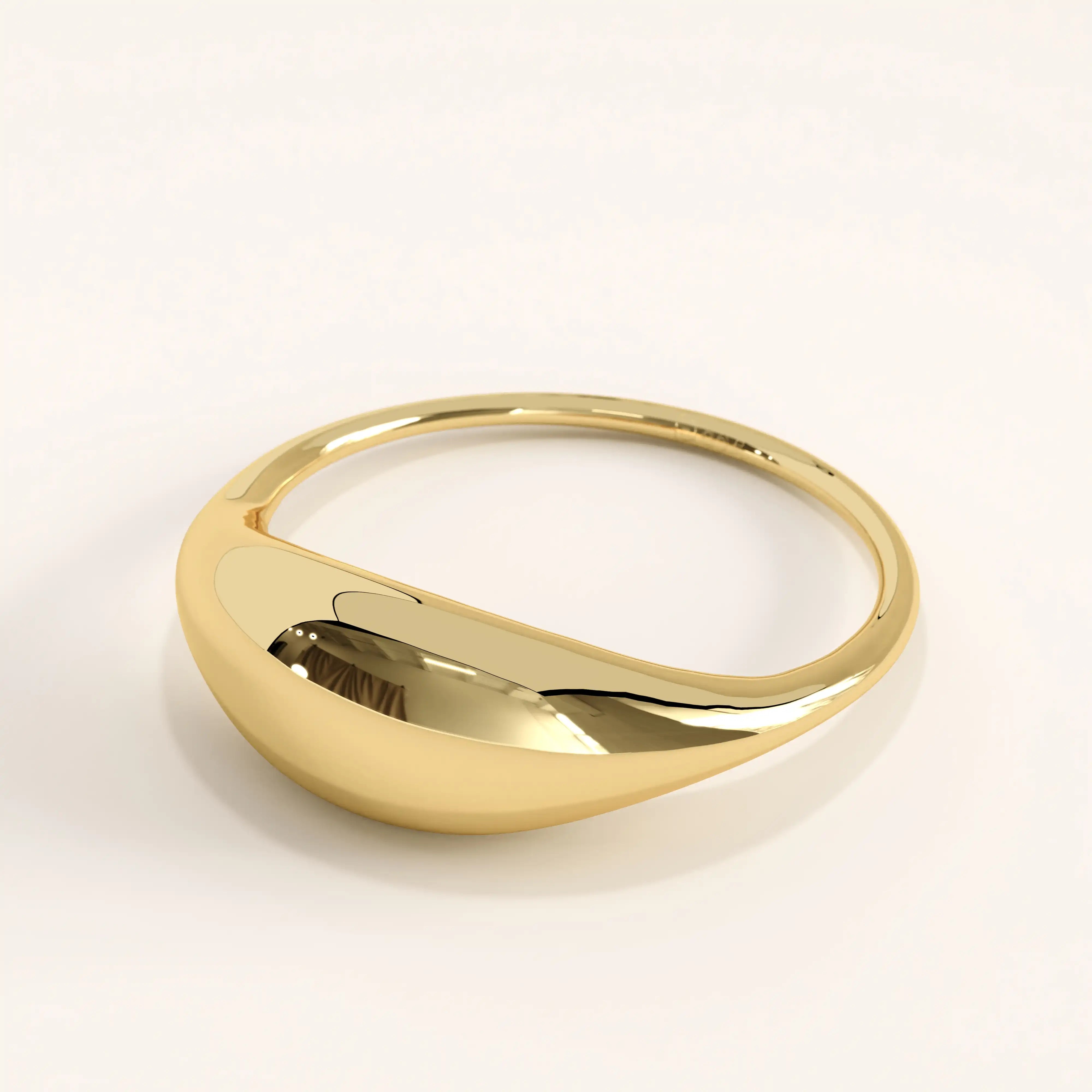 Side view of 14k gold vermeil dome signet ring highlighting its smooth curvature and bold domed profile with a reflective polished finish.
