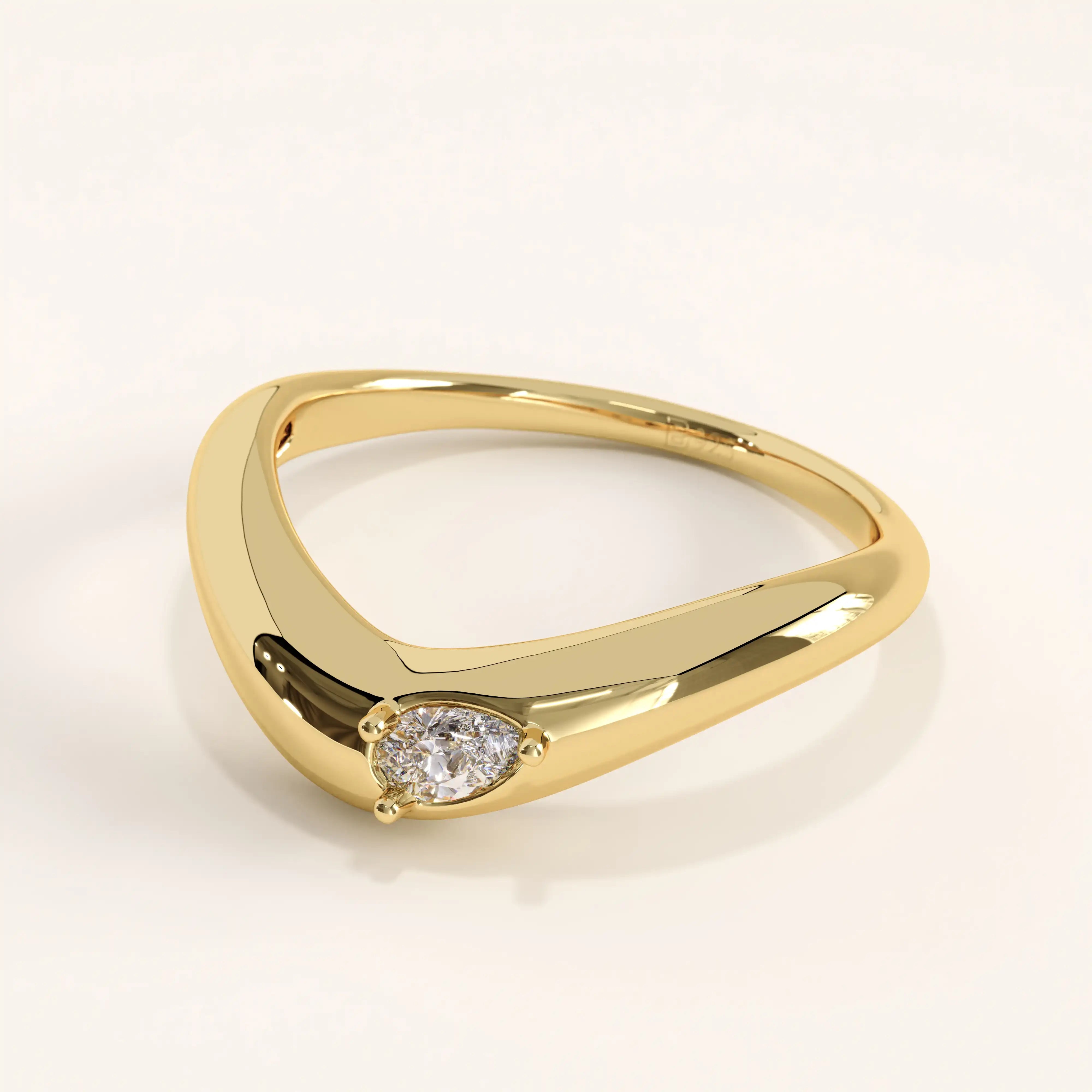 Side view of 14k gold vermeil pear curve ring highlighting its fluid shape and the subtle brilliance of the pear-cut gemstone.

