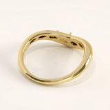 Side view of 14k gold vermeil pear curve ring highlighting its fluid shape and the subtle brilliance of the pear-cut gemstone.
