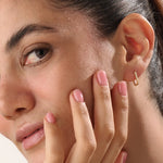 Model wearing 14k gold vermeil rectangle hoop earrings that highlight their clean, sculptural lines and lustrous golden sheen — ideal for modern everyday style.
