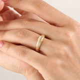 Model wearing a 14k gold vermeil ribbed dome ring showcasing its modern grooved design and bold polished shine for a chic everyday look.
