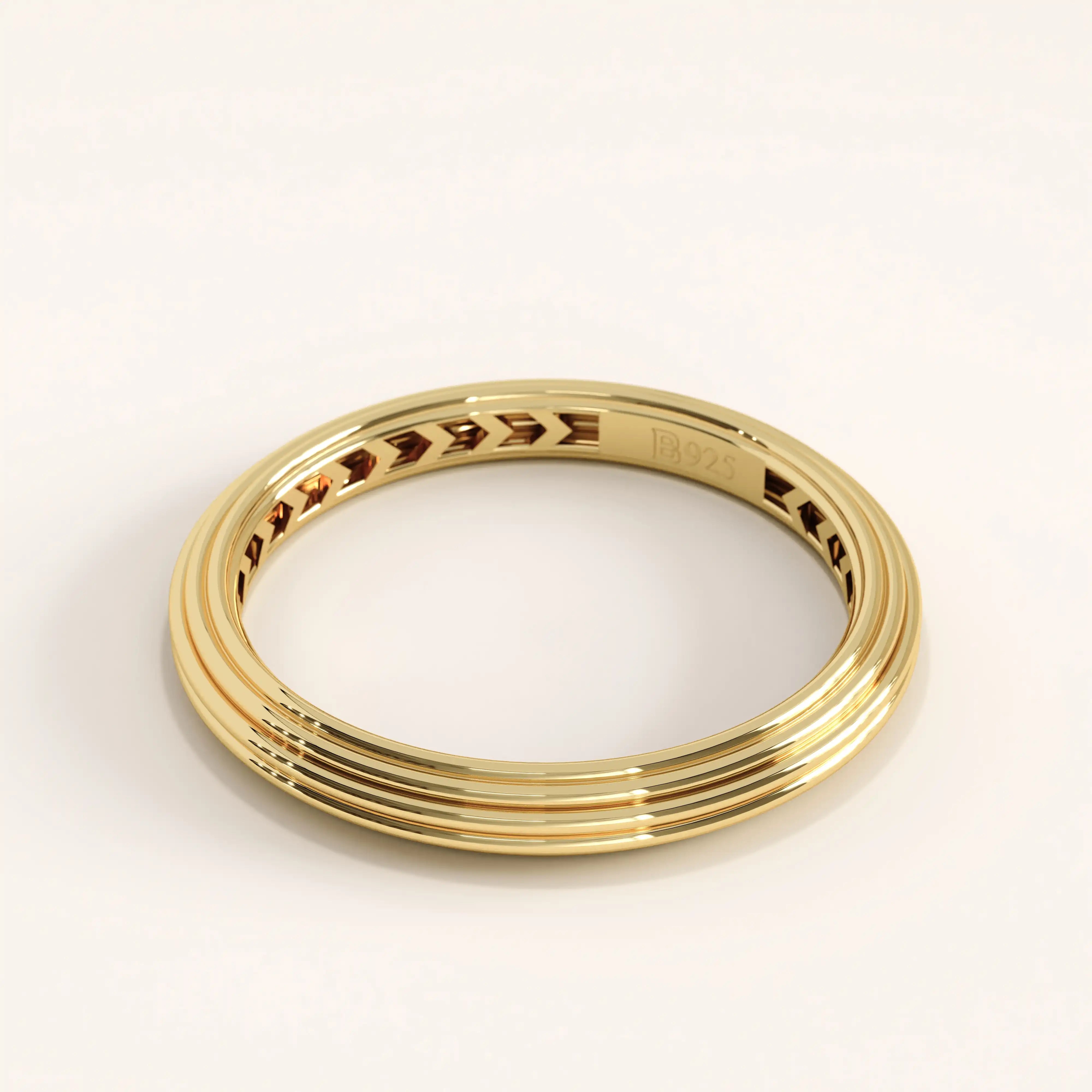 Side view of 14k gold vermeil simple band ring showcasing its smooth triple-line detailing and reflective glossy finish.
