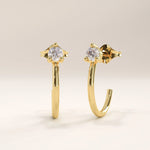 Side view of 14k gold vermeil solo hoop earrings highlighting the curved design and precision-set cubic zirconia that adds a radiant touch from every angle.
