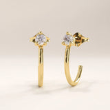 Side view of 14k gold vermeil solo hoop earrings highlighting the curved design and precision-set cubic zirconia that adds a radiant touch from every angle.
