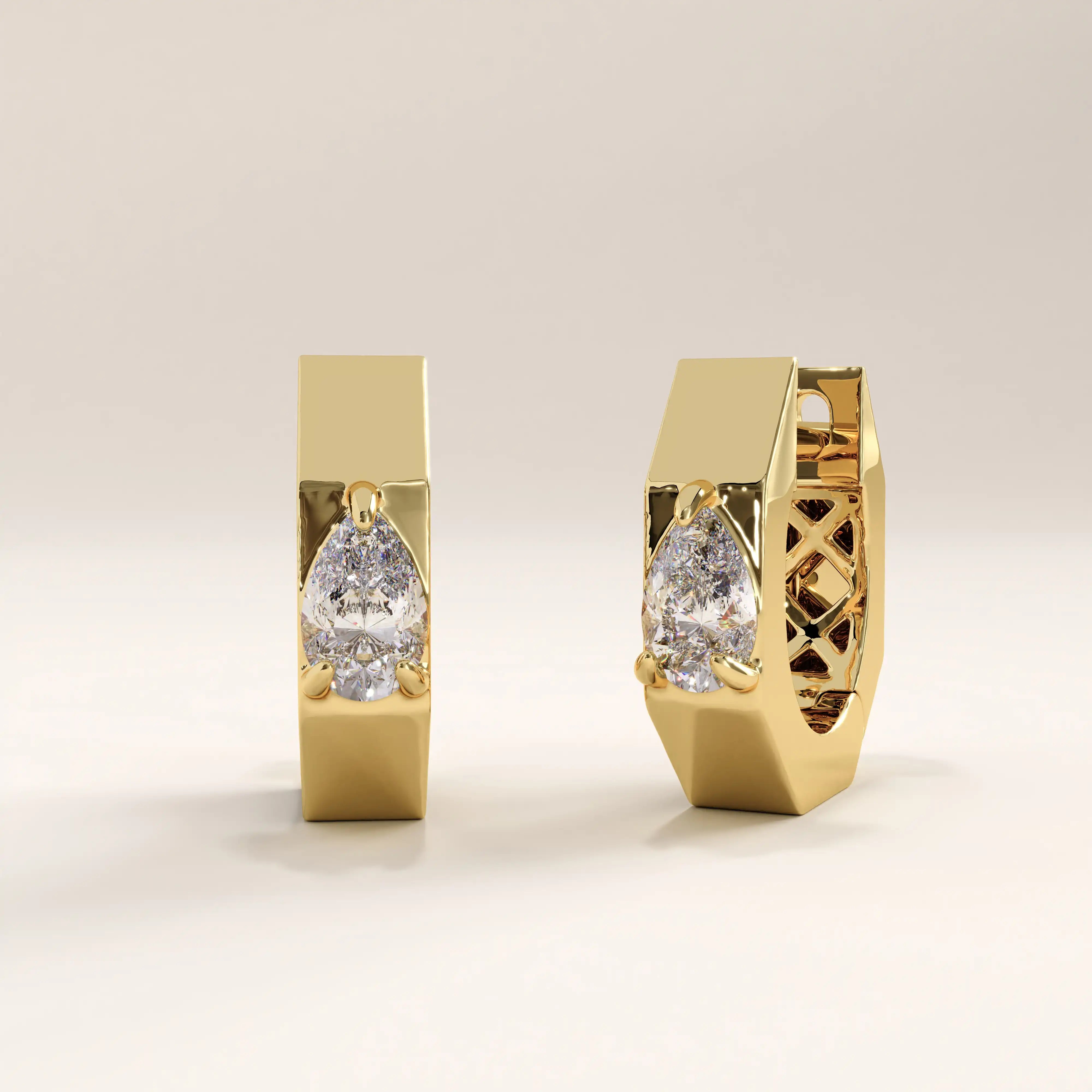 Side view of 14k gold vermeil solo pear hoop earrings showcasing the angular hoop profile and secure hinge closure for a contemporary statement look.
