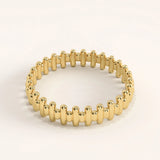 Side angle of 14k gold vermeil striped ring highlighting its polished ridged texture and sculptural detailing.

