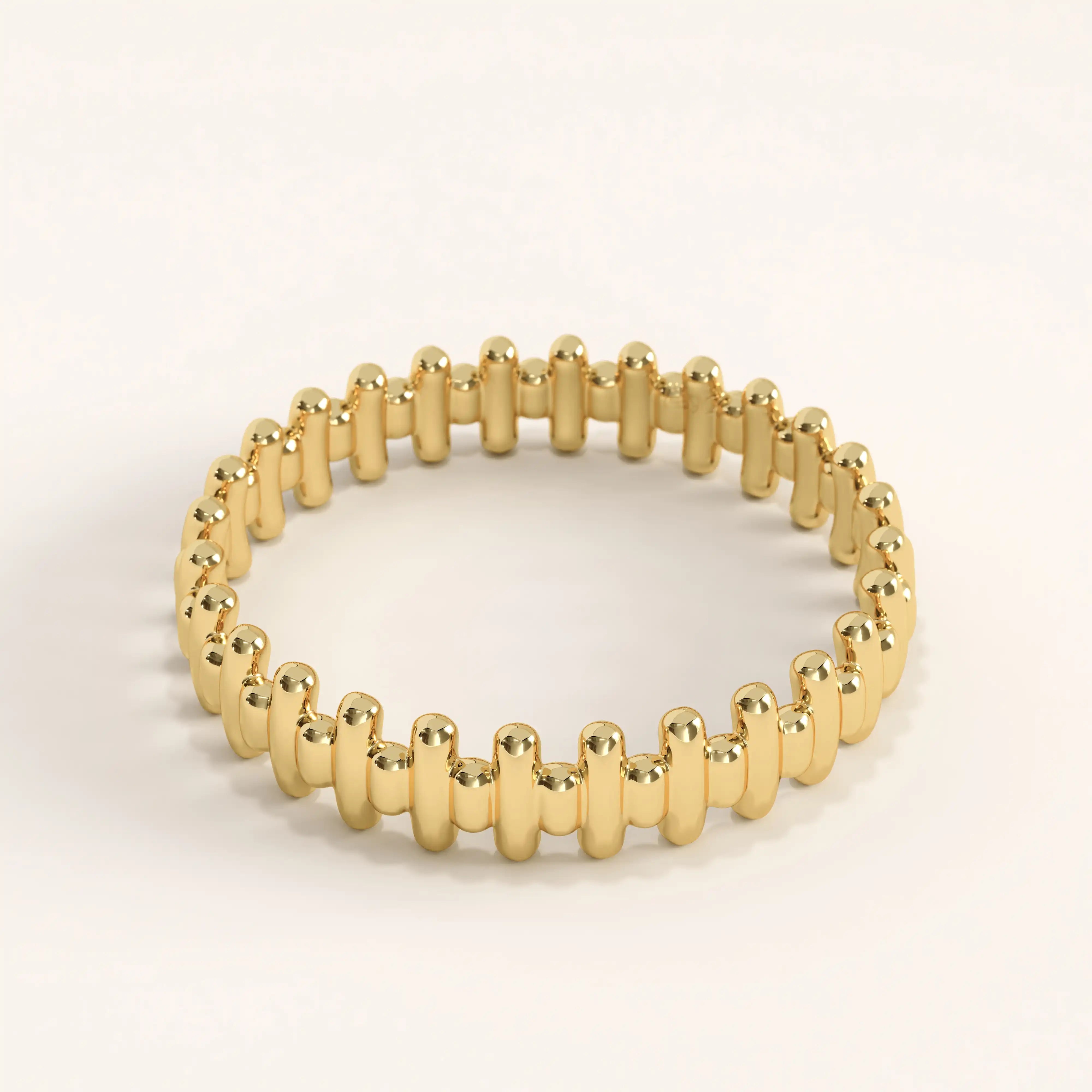 Side angle of 14k gold vermeil striped ring highlighting its polished ridged texture and sculptural detailing.
