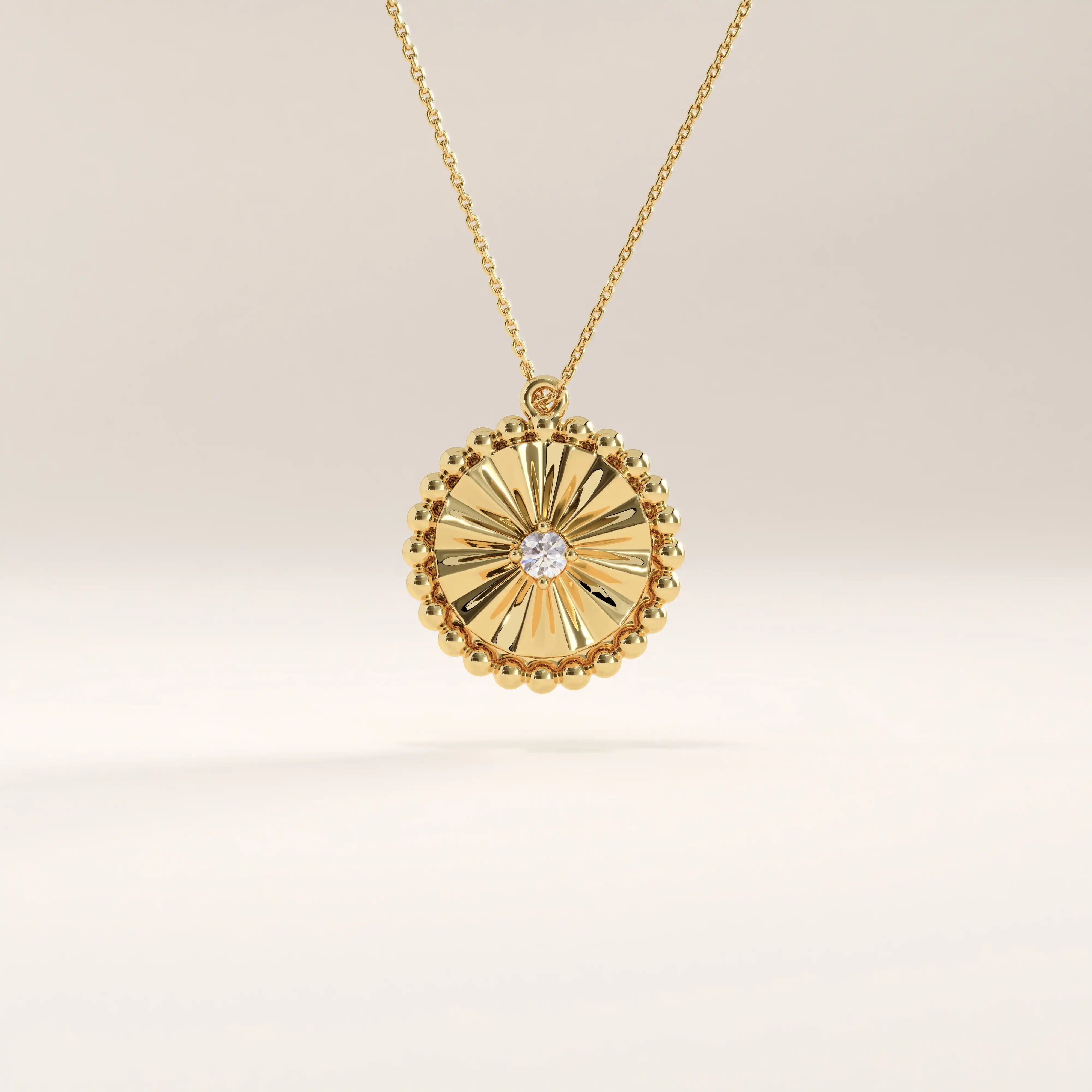 Side view of 14k gold vermeil textured coin necklace highlighting the three-dimensional sunburst engraving and polished bead-edge craftsmanship that catch the light beautifully.
