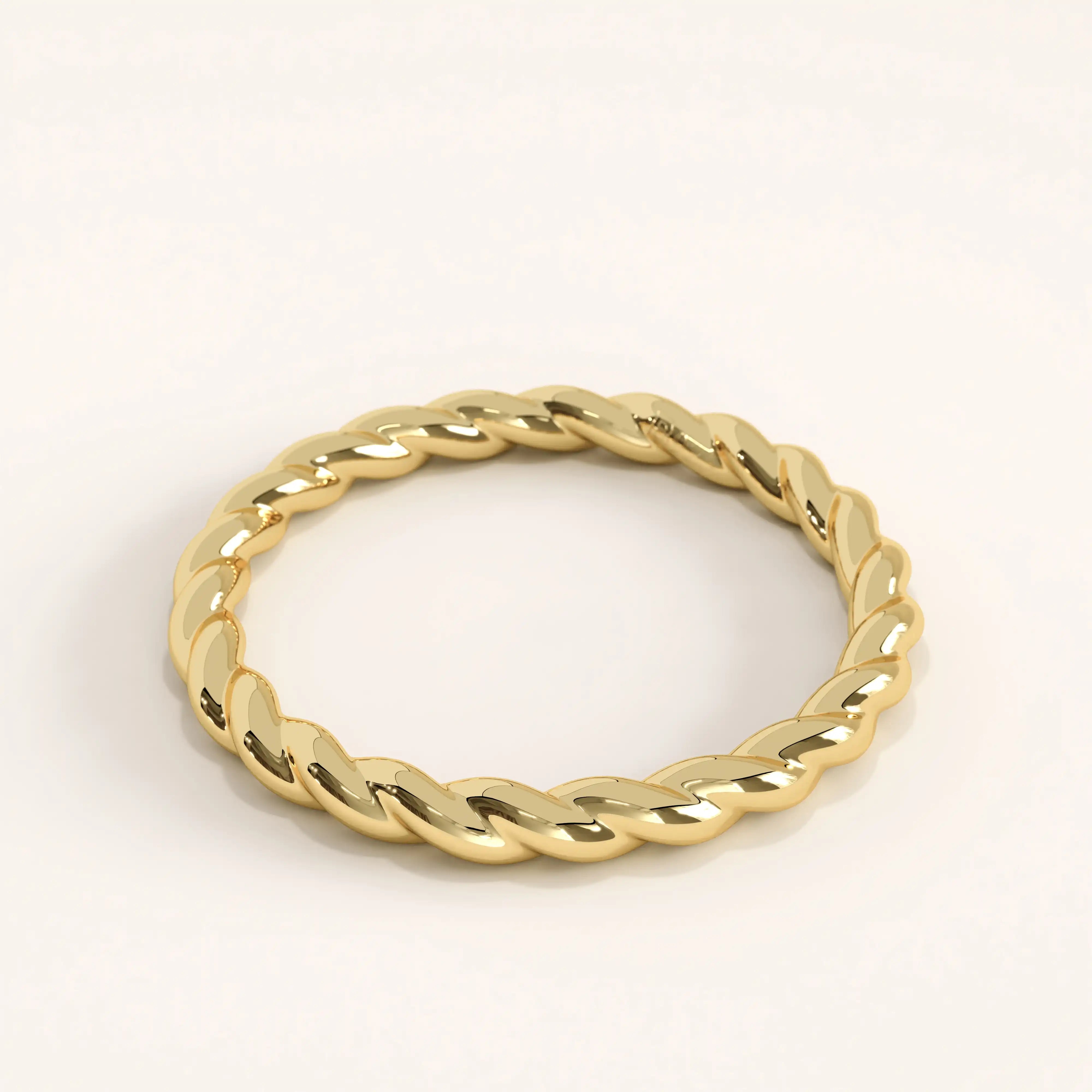 Side angle of 14k gold vermeil twisted rope ring showcasing its smooth interwoven texture and reflective finish.
