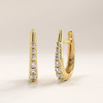 Side view of 14k gold vermeil U shape hoop earrings highlighting the contoured profile and prong-set stones for a graceful, luminous finish.
