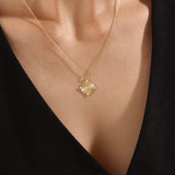 Model wearing a 14k gold vermeil unique round necklace featuring a dimensional circular pendant with radiant concentric rings and cubic zirconia accents for refined brilliance.
