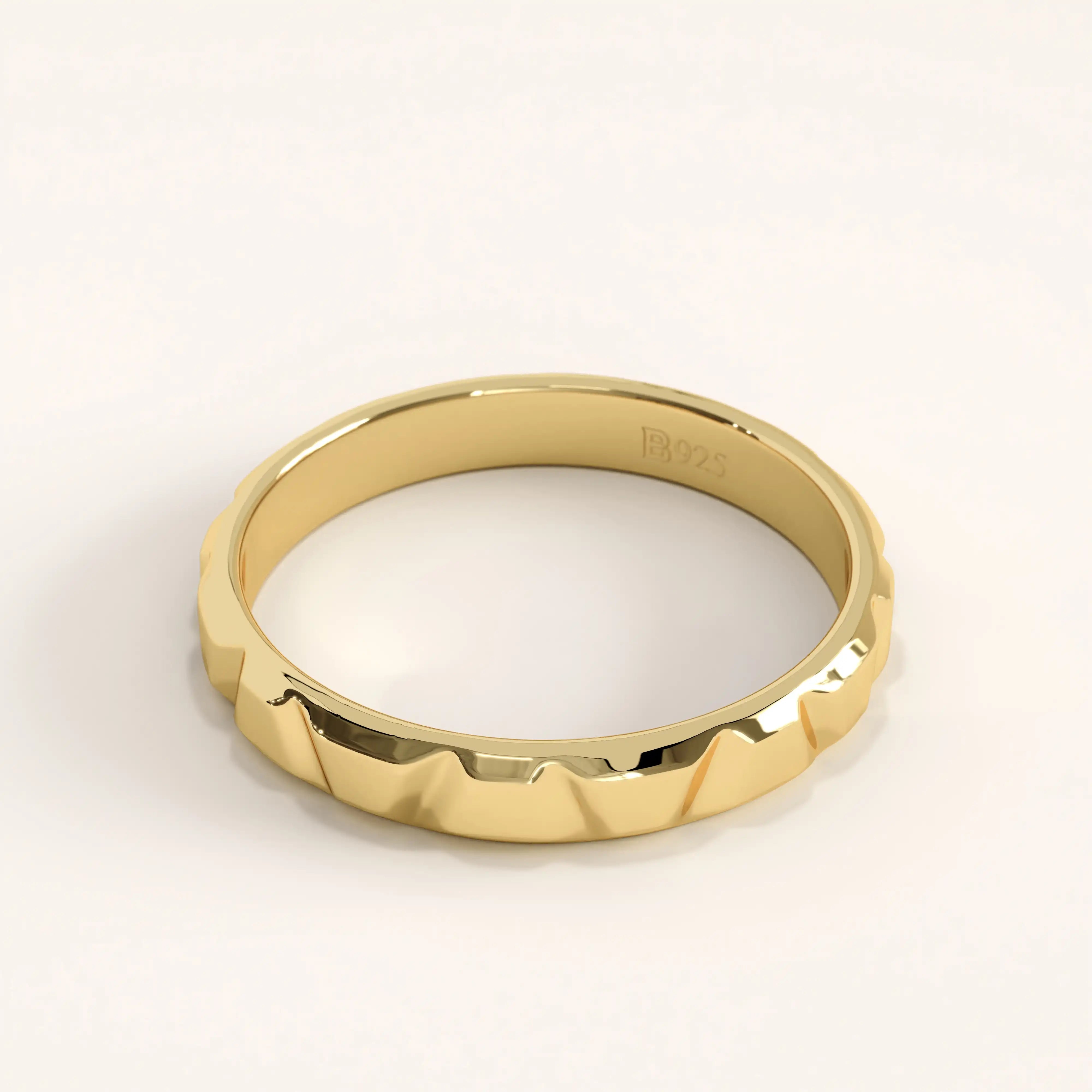 Side angle of 14k gold vermeil unique wedding band highlighting its angular facets and smooth inner band for comfortable wear.
