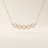 5 stone bezel necklace in 14k rose gold showcasing five bezel-set round stones along a dainty chain.
