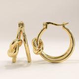 14k gold vermeil knot hoop earrings featuring a smooth, polished finish and elegant knot detail symbolizing unity and timeless sophistication.
