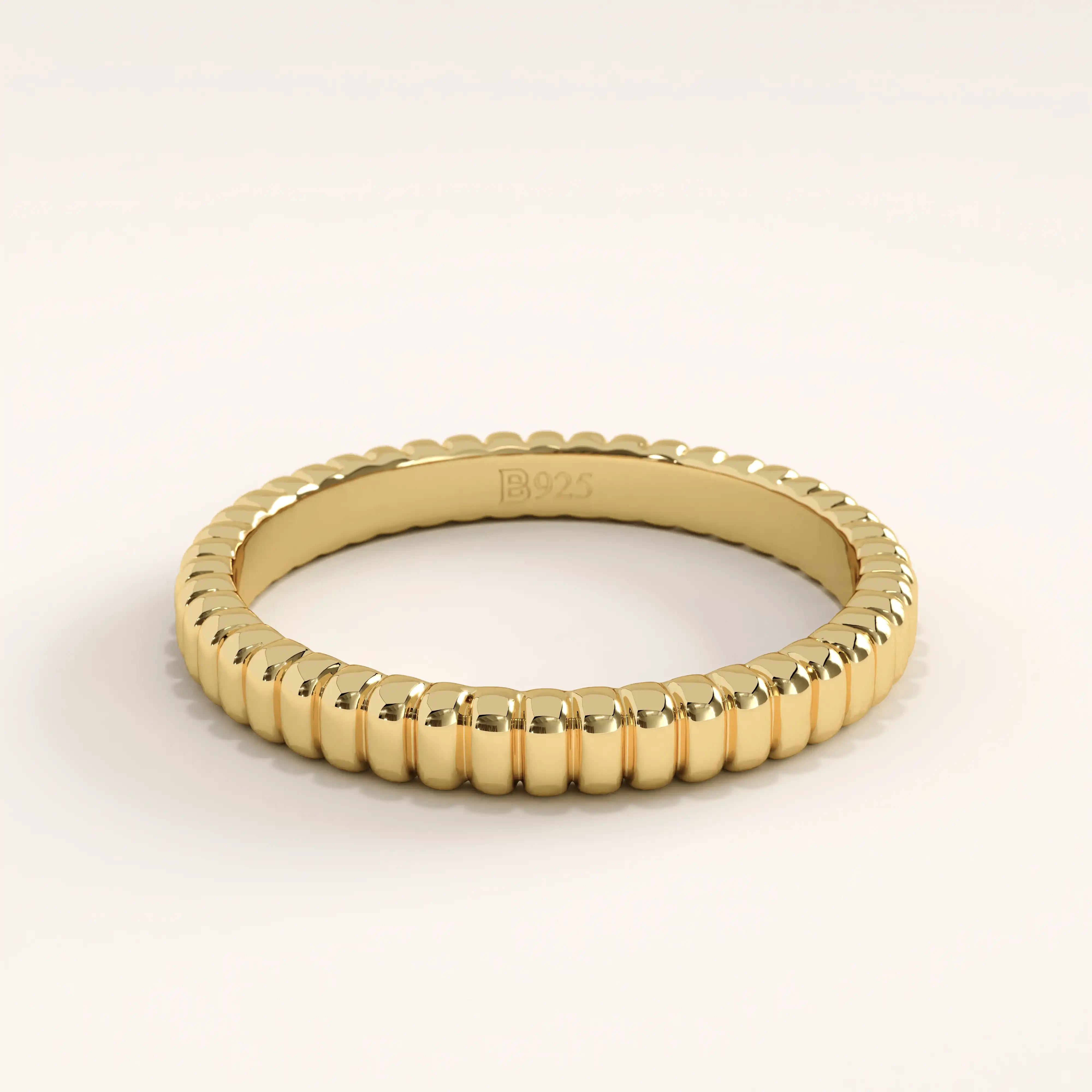 14k gold vermeil minimalist band ring with a sleek ridged texture, dainty gold stacking ring for women’s everyday jewelry.
