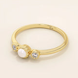 14k solid gold small freshwater pearl engagement ring with tiny moissanite side stones for women