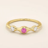 stacking wedding ring with a sparkling lab-grown ruby birthstone with moissanite stones each securely set in a bezel in 14k solid gold for women