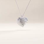 Silver vermeil 3D heart necklace showcasing a dimensional wavy heart design with a luminous cubic zirconia accent, perfect for everyday elegance.
