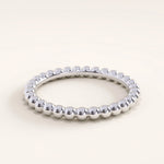 Silver vermeil beaded band ring with smooth rounded beads forming a refined, stackable design ideal for layering or everyday wear.
