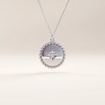 Silver vermeil beaded coin necklace showcasing a smooth circular pendant bordered by fine beading and accented with a small cubic zirconia for refined, timeless charm.
