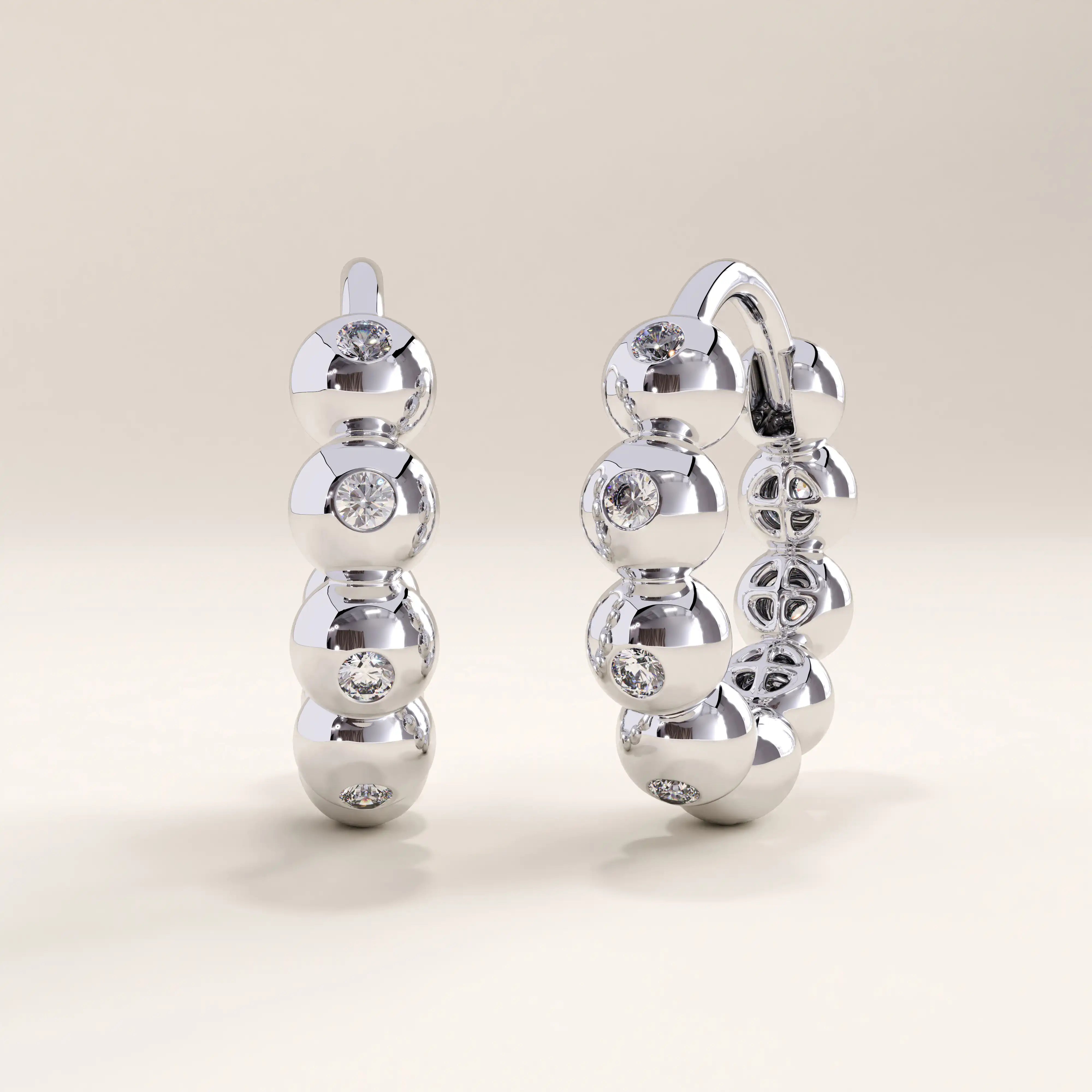 Silver vermeil beaded hoop earrings with smooth rounded beads and delicate cubic zirconia details, adding refined sparkle to a timeless hoop silhouette.
