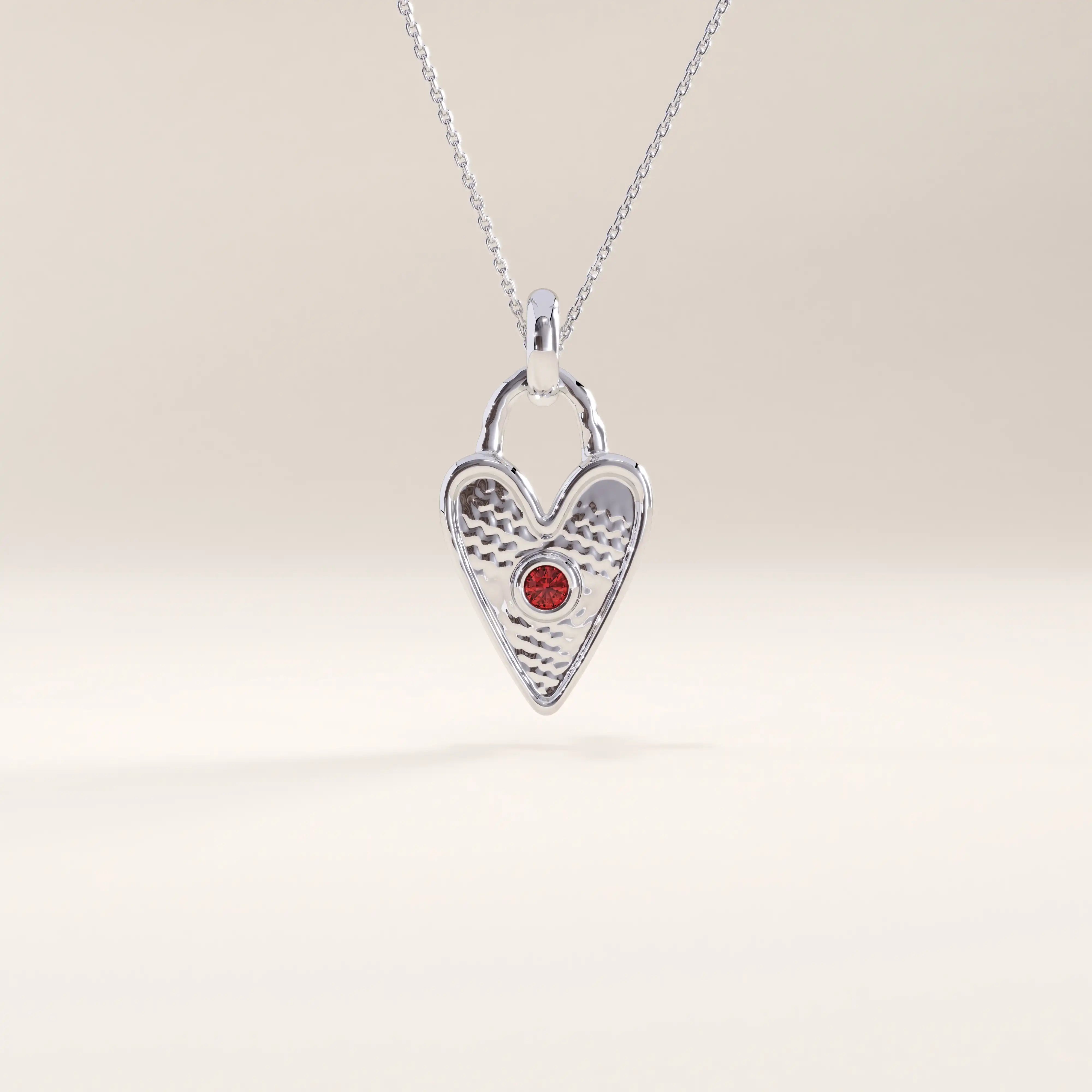 Silver vermeil birthstone heart necklace showcasing a delicate heart lock design with a colored gemstone centerpiece symbolizing birth month and individuality.
