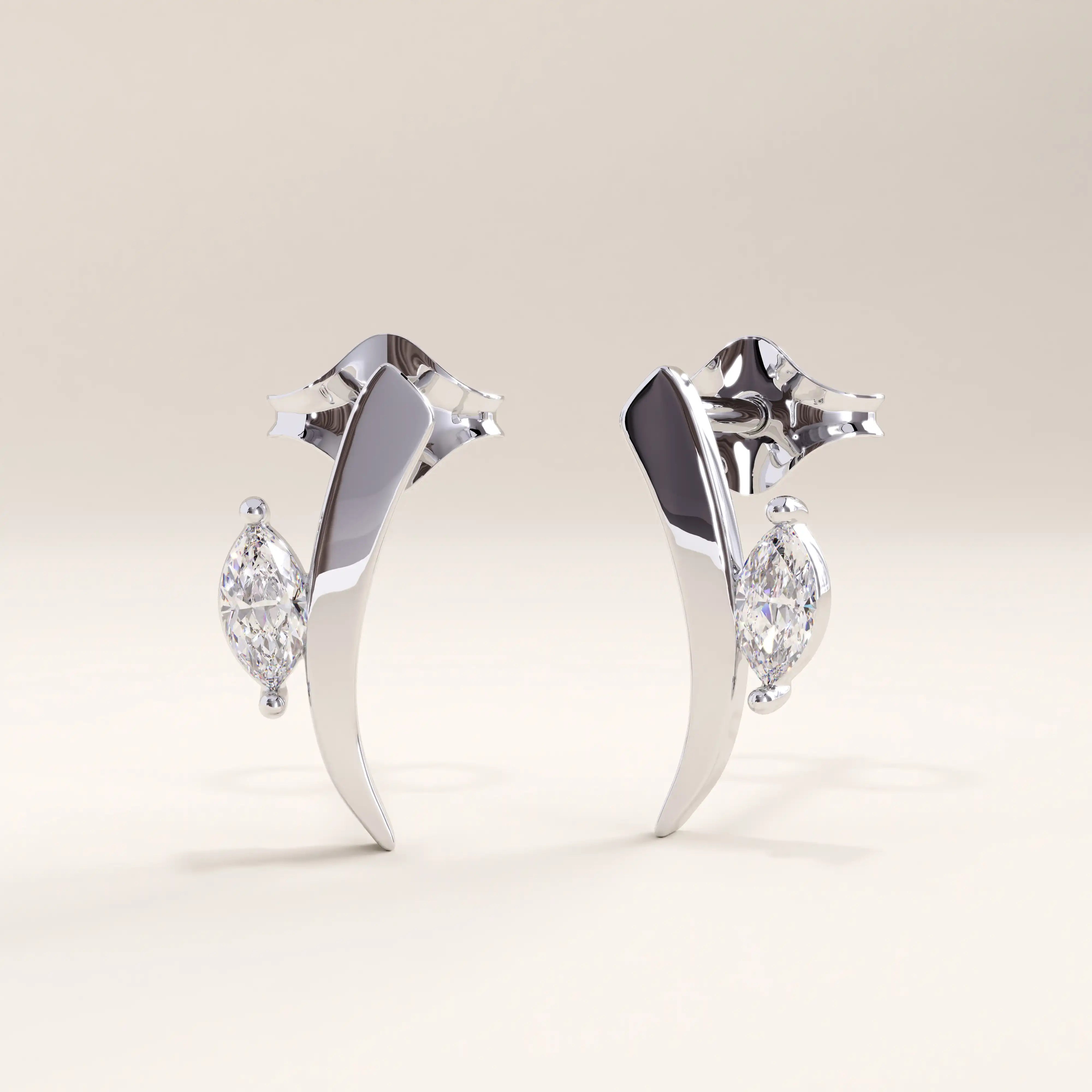 Silver vermeil curvy marquise earrings with an elegant flowing shape and a sparkling marquise-cut cubic zirconia centerpiece, balancing minimalism and glamour.
