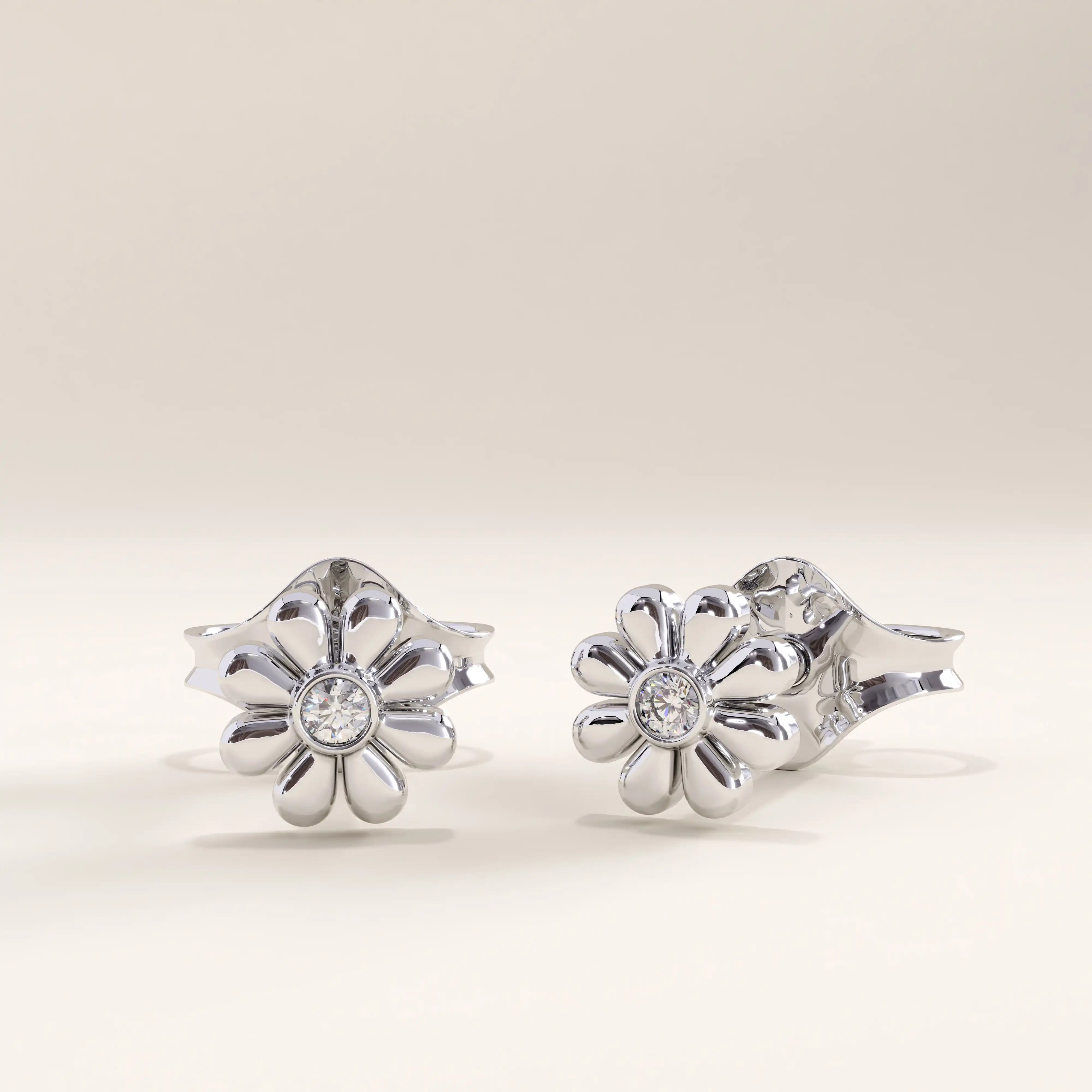Silver vermeil daisy stud earrings crafted with a polished petal design and a sparkling cubic zirconia centerpiece, combining playful beauty with classic sophistication.
