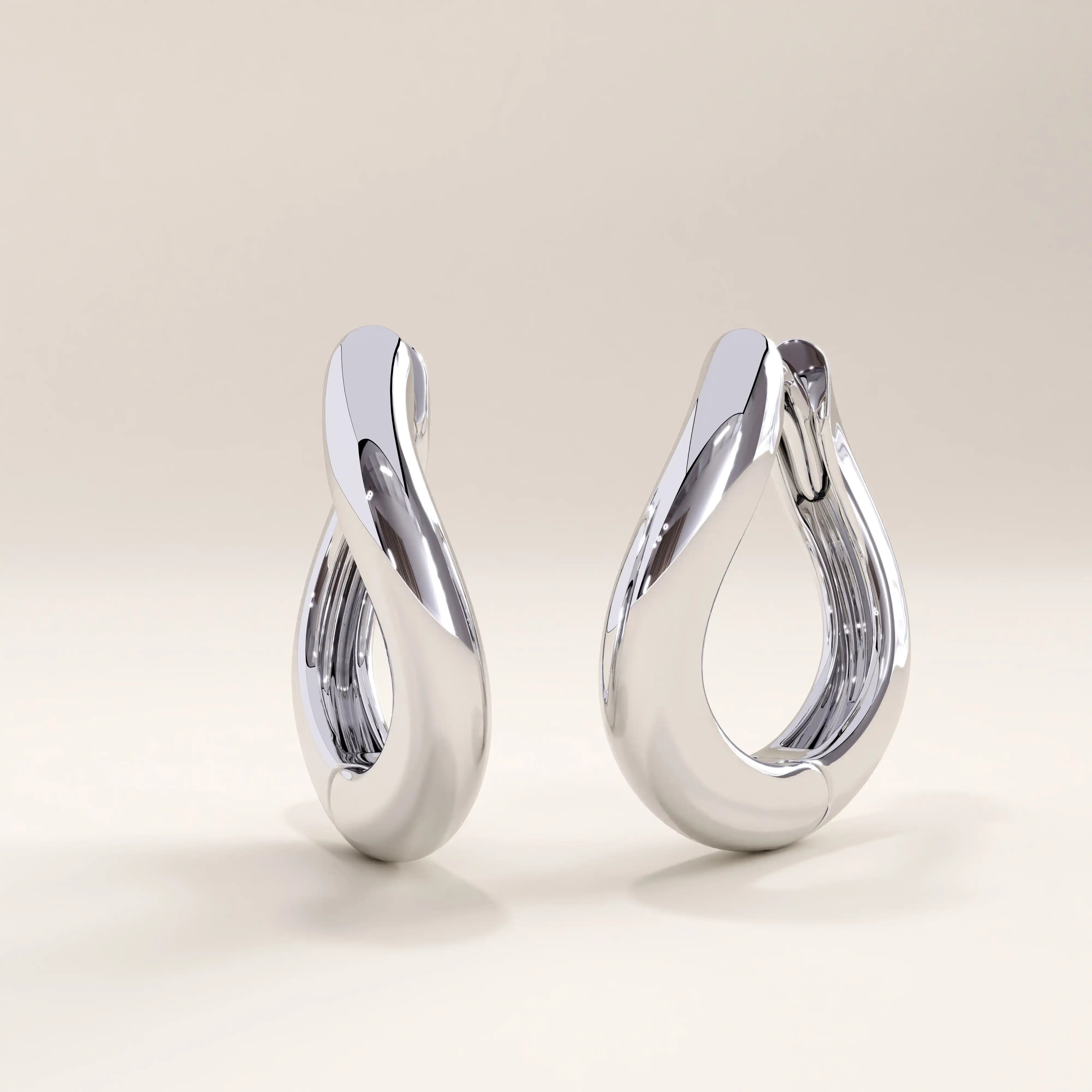 Silver vermeil dome hoop earrings crafted with a rounded, fluid form and mirror-like shine for a sophisticated minimalist statement.
