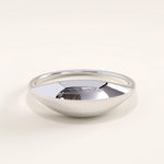 Silver vermeil dome signet ring featuring a sleek and curved silhouette with a mirror-like shine, perfect for modern minimalist style.
