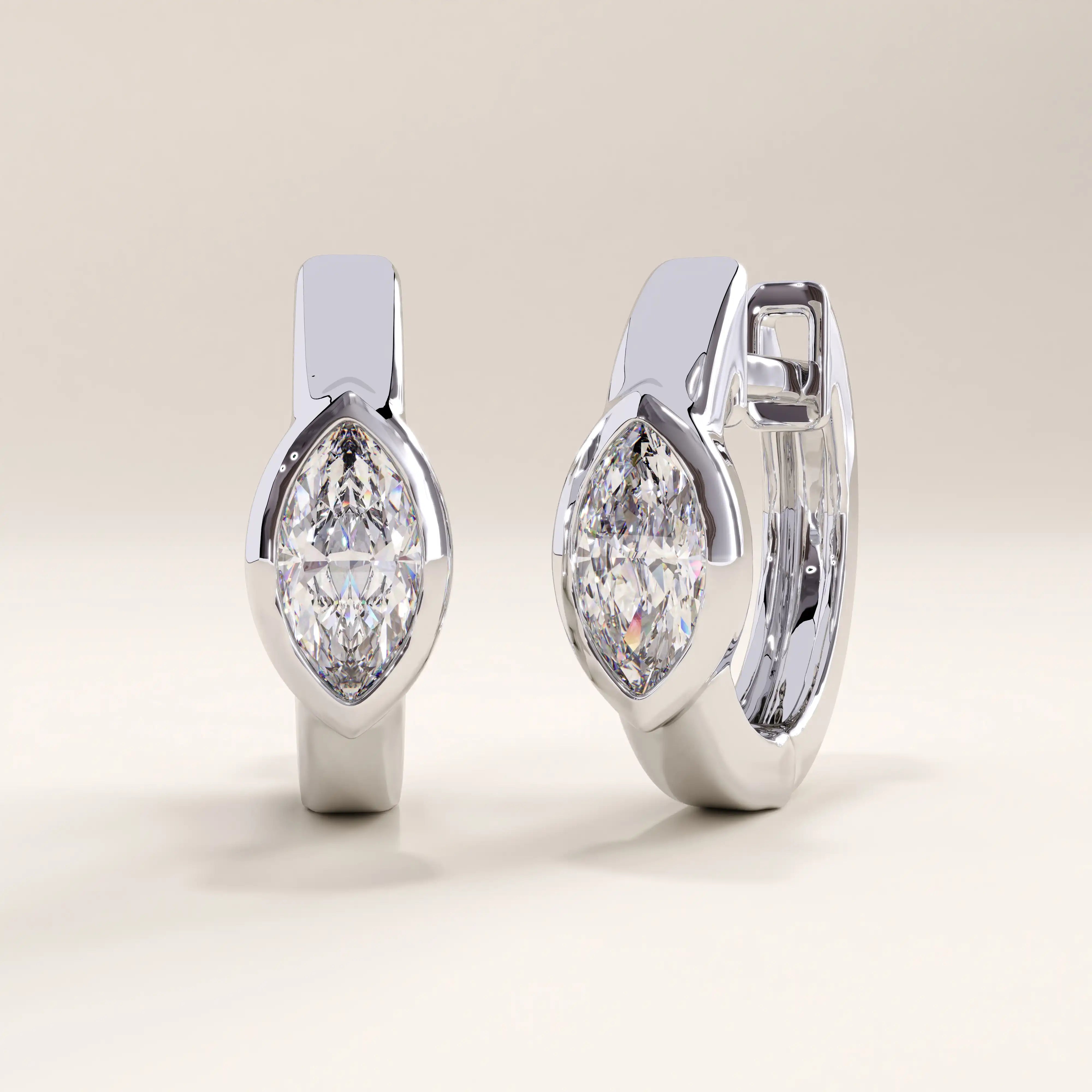 Silver vermeil marquise bezel hoop earrings showcasing a sleek, polished design with a brilliant marquise stone for timeless sophistication.
