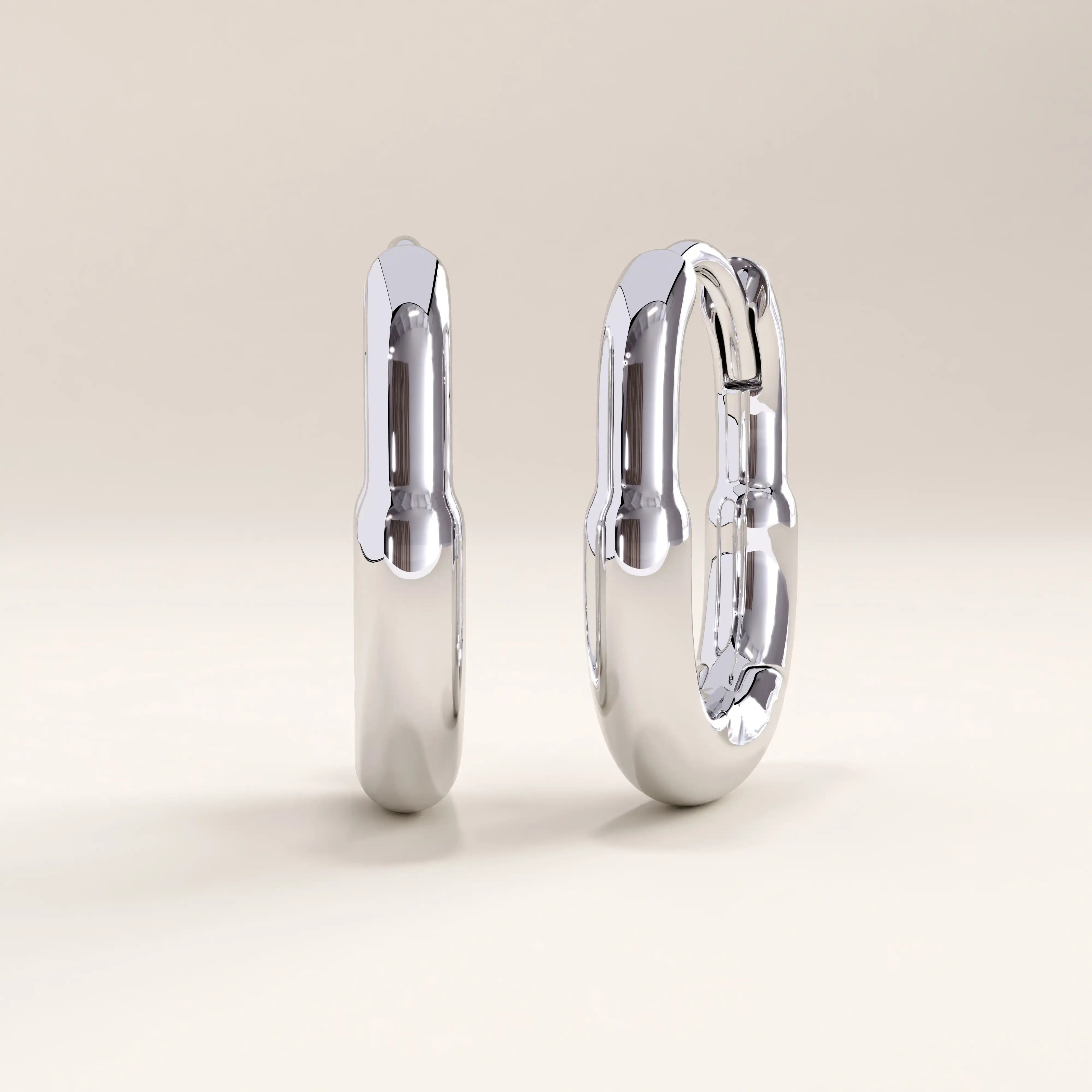 Silver vermeil oval hoop earrings with a smooth, contemporary design and mirror-like shine, perfect for effortless, everyday sophistication.

