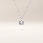 Silver vermeil princess solitaire necklace showcasing a precision-cut cubic zirconia in a geometric square setting, offering an elegant minimalist shine.
