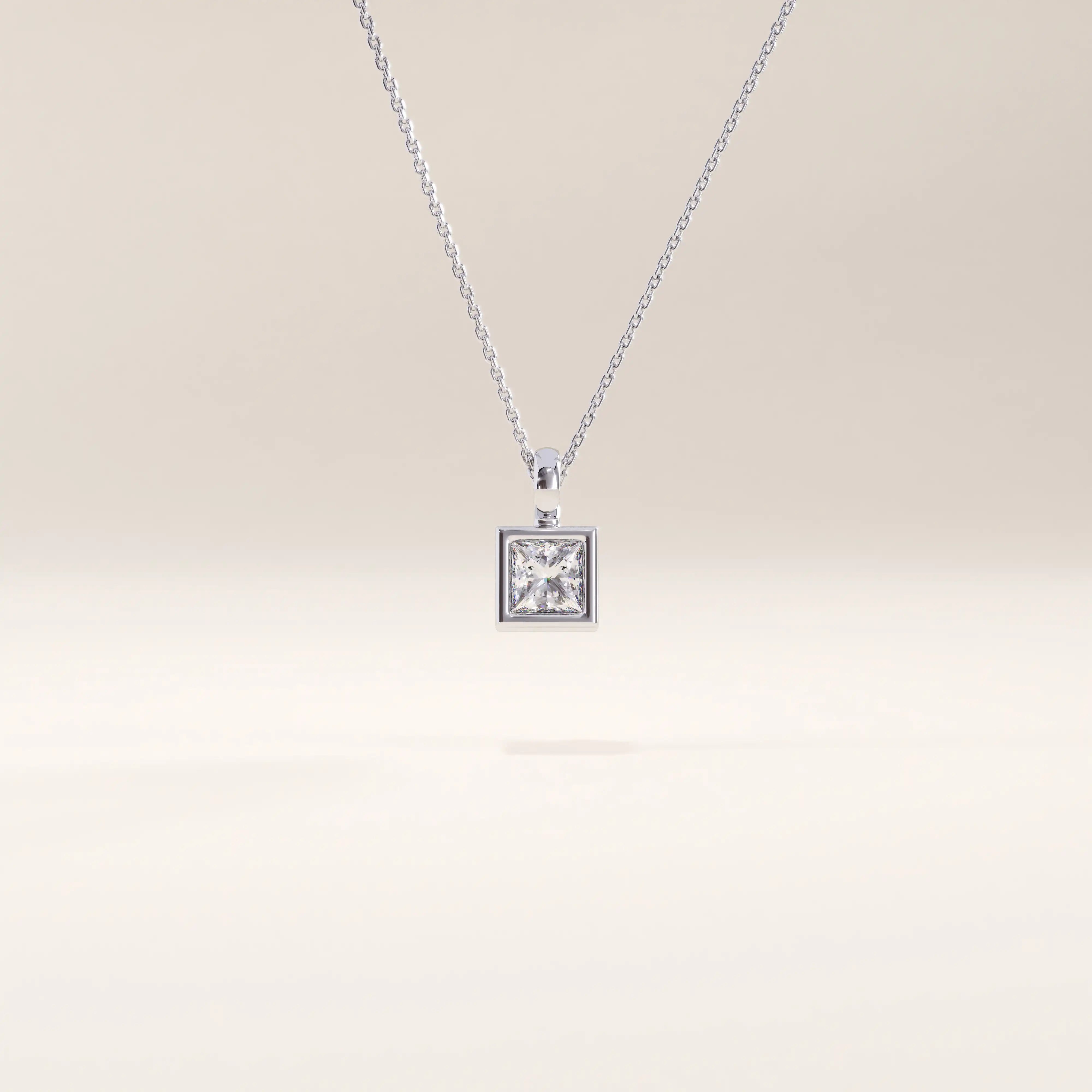 Silver vermeil princess solitaire necklace showcasing a precision-cut cubic zirconia in a geometric square setting, offering an elegant minimalist shine.
