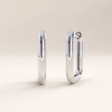 Silver vermeil rectangle hoop earrings with a minimalist geometric design and mirror-like shine, perfect for contemporary elegance.
