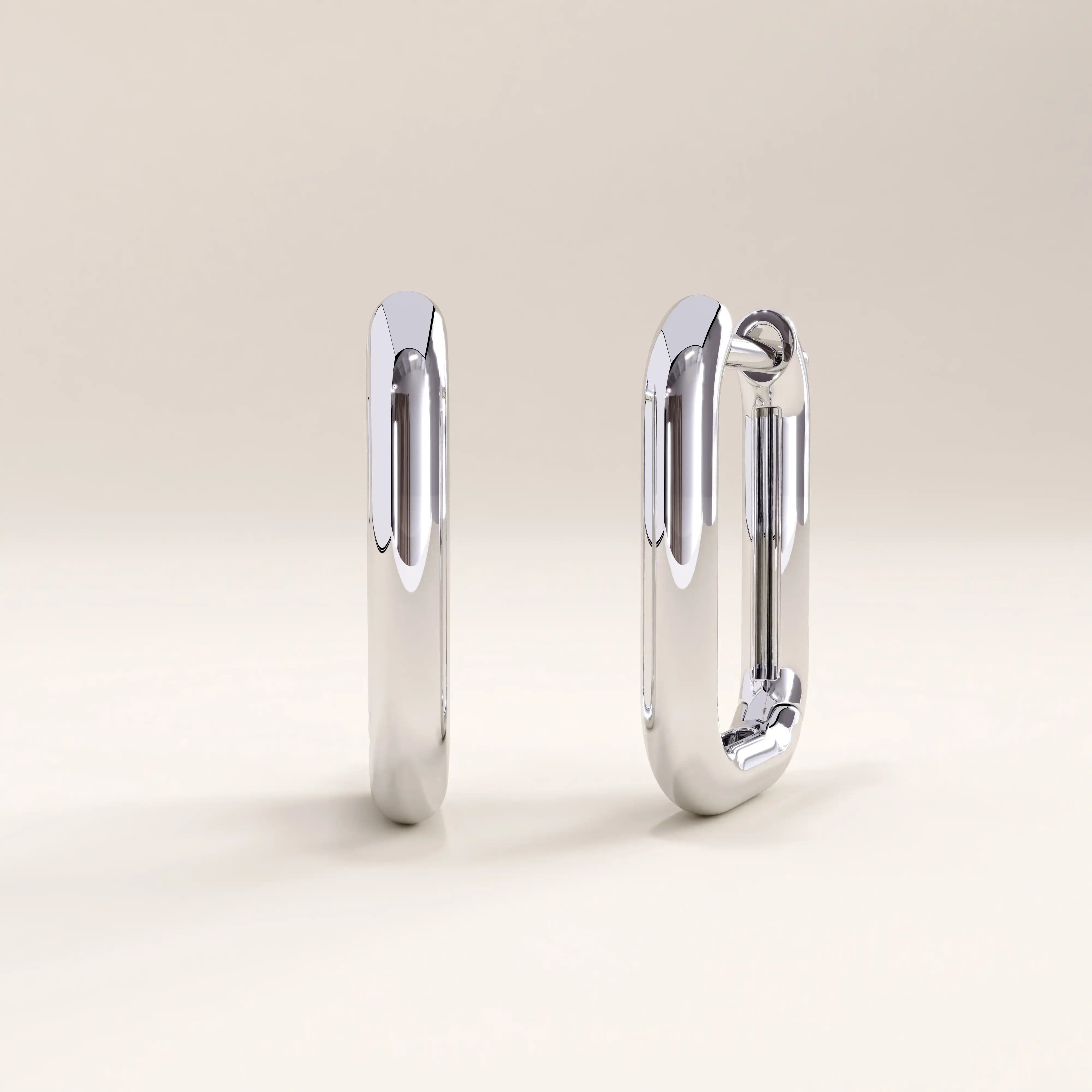Silver vermeil rectangle hoop earrings with a minimalist geometric design and mirror-like shine, perfect for contemporary elegance.
