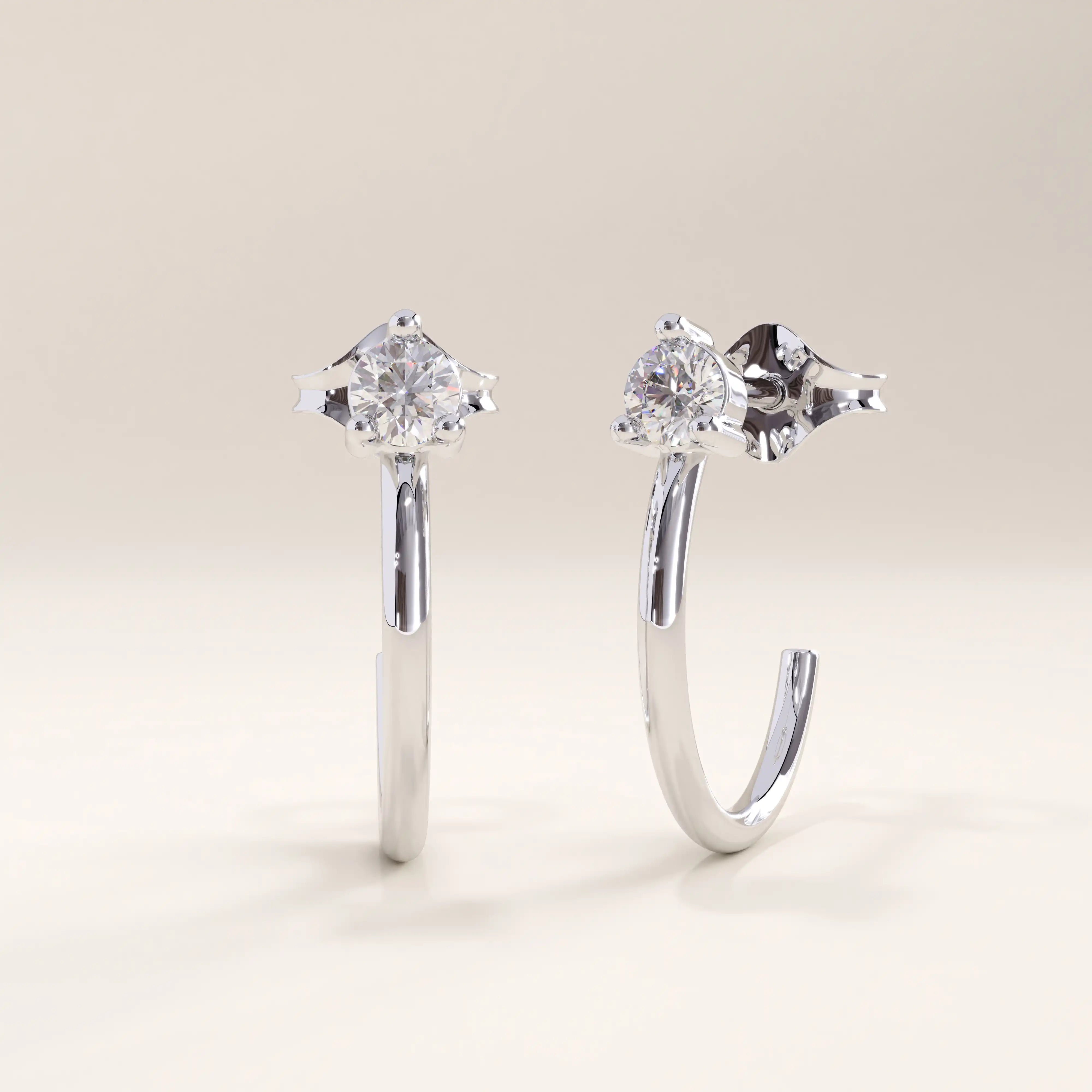 Silver vermeil solo hoop earrings designed with a polished curved band and a single cubic zirconia stone at the center, combining minimalist style with elegant shine.
