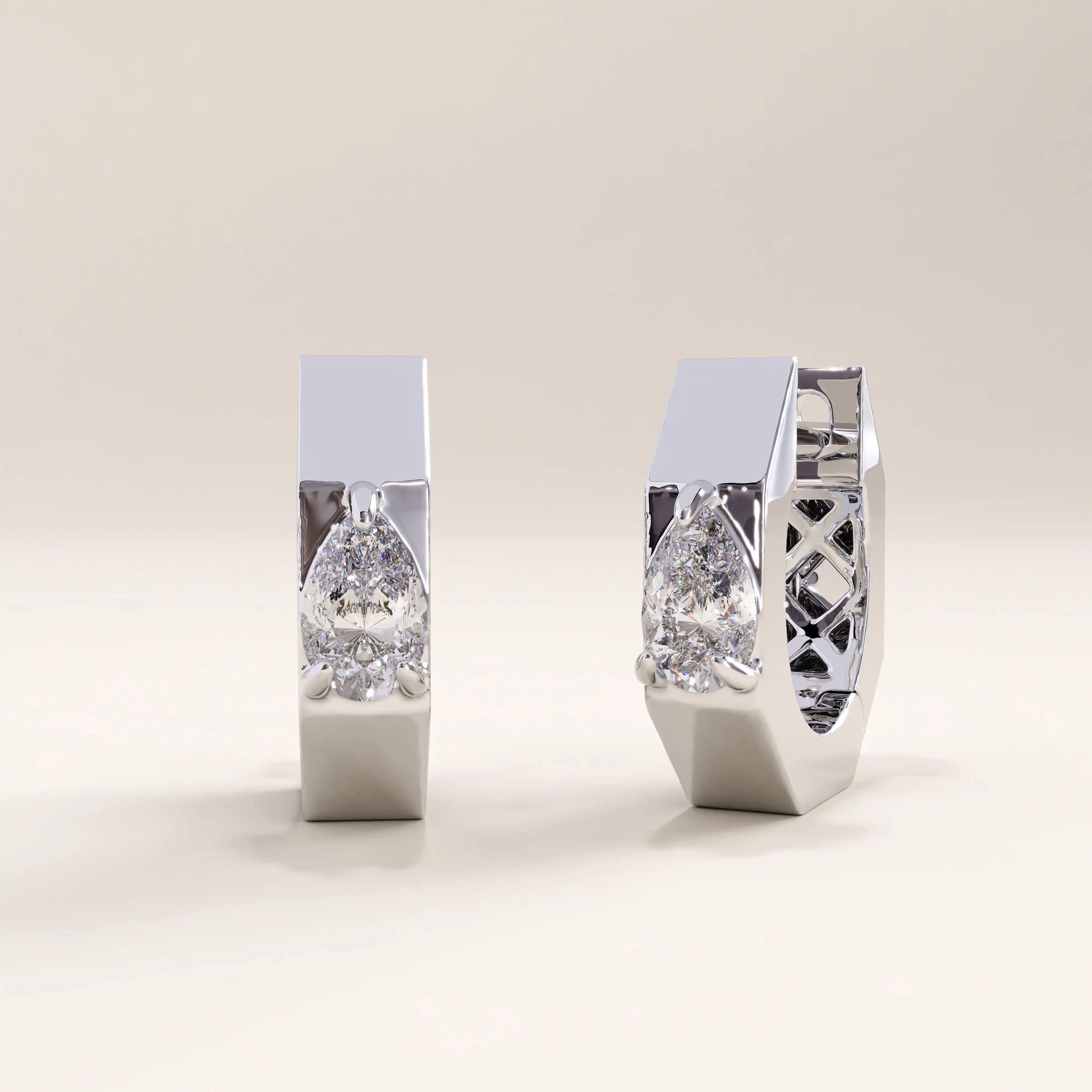 Silver vermeil solo pear hoop earrings with a sleek silhouette and shimmering pear-shaped gemstone for understated yet luxurious appeal.
