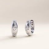 Silver vermeil star hoop earrings with sparkling cubic zirconia accents and star motifs, blending celestial charm with a sleek, refined silhouette.
