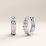 Silver vermeil textured hoop earrings with a shimmering faceted design for a modern, handcrafted look that enhances any style with understated elegance.
