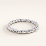 Silver vermeil twisted rope ring with a shiny braided texture, timeless minimalist band ideal for stacking or solo wear.
