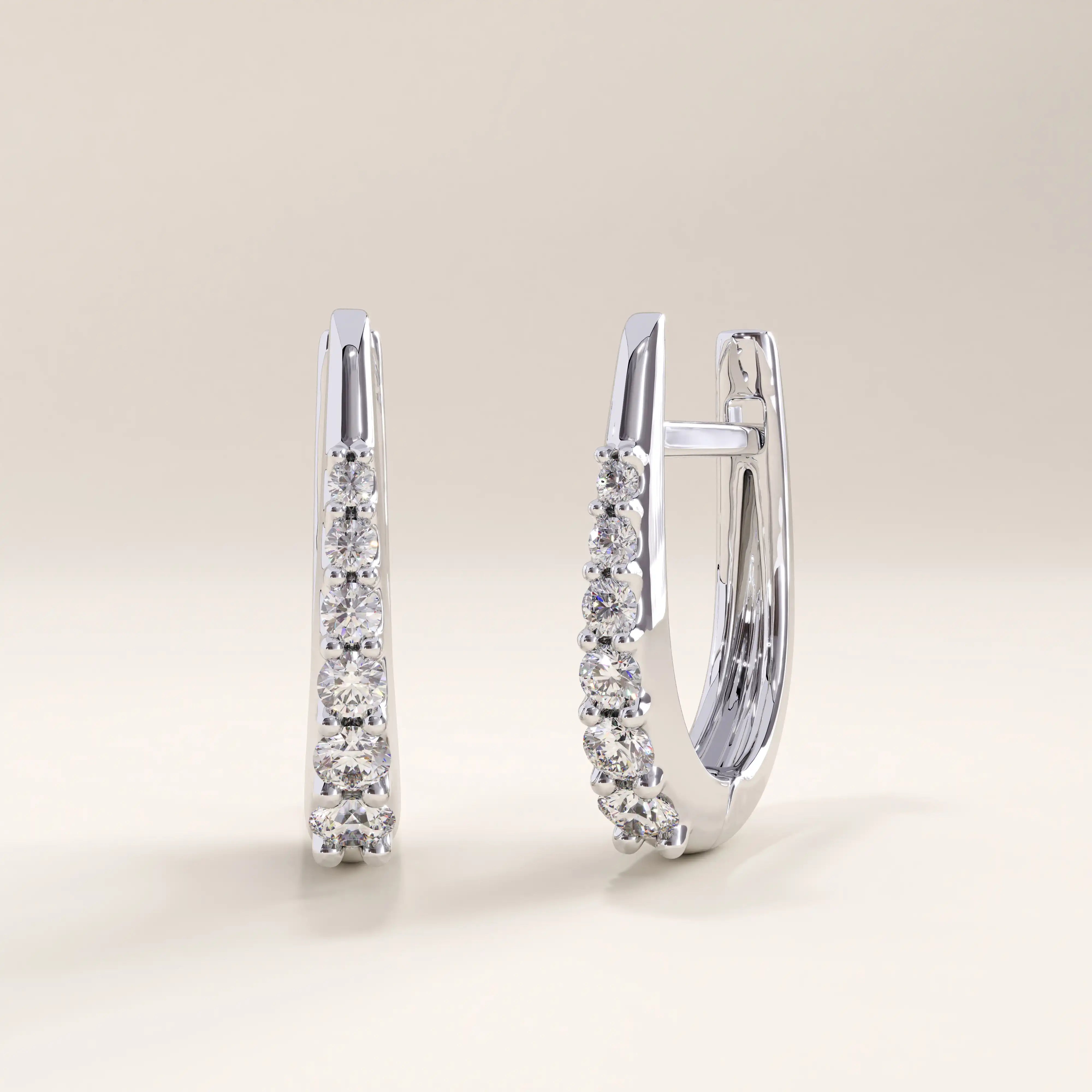 Silver vermeil U shape hoop earrings with a delicate line of cubic zirconia stones, offering a refined balance of shine and minimalism.
